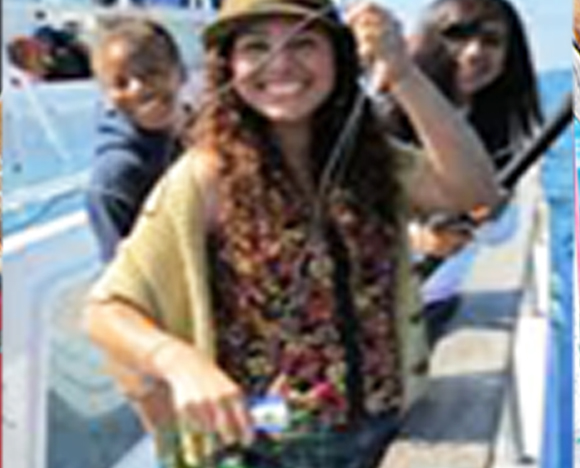 Students participating in the science education program pose and smile for the camera.